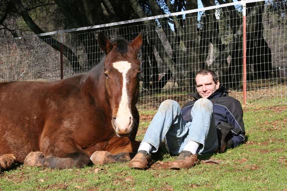 Jeff relaxing in pasture with his horse, U-turn